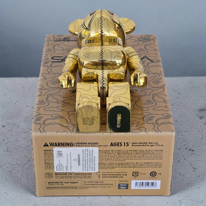 Bearbrick Sorayama × BAPE® Camo Shark Gold 100%+400% Echtheitsmerkmale